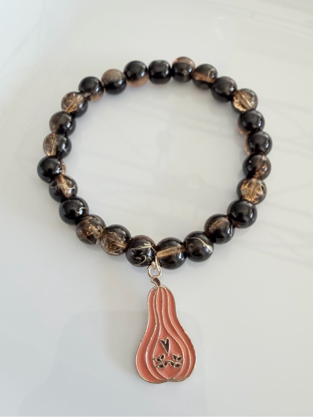 Brown Beaded Bracelet with Orange Gourd Charm